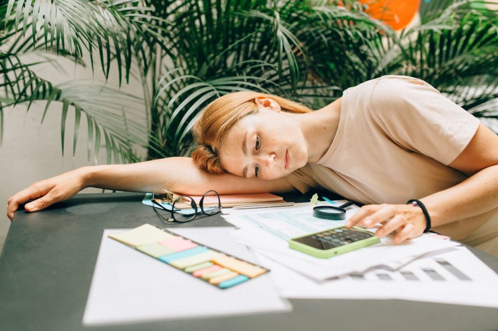 A Woman using a Calculator using Smartphone